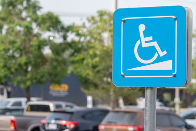 Blue accessibility sign in city