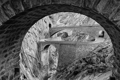 Schöllenen gorge close to andermatt with the famous stone bridge known as the teufelsbrücke.