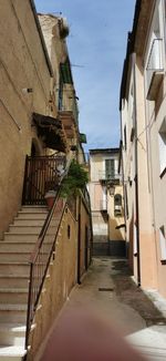 Narrow alley amidst buildings in town