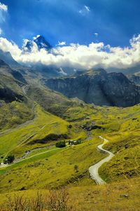 Scenic view of landscape with windy road against sky