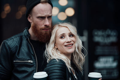 Portrait of young couple with coffee