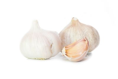 Close-up of garlic against white background