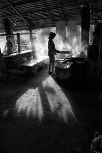 Women cooking food in hut