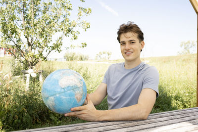 Portrait of boy playing soccer on field