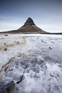 Scenic view of mountains against sky during winter