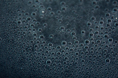 Full frame shot of raindrops on metal