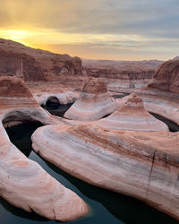 Scenic view of desert against sky during sunset