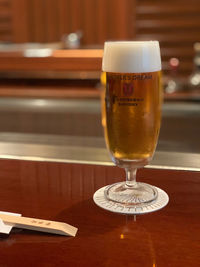 Close-up of beer glass on table