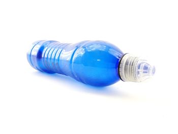 Close-up of light bulb against white background