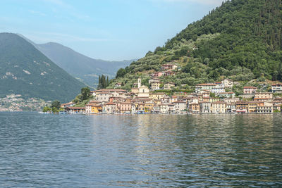 Landscape of the lakeside of peshiera maraglio in monte isola with beautiful colored houses 