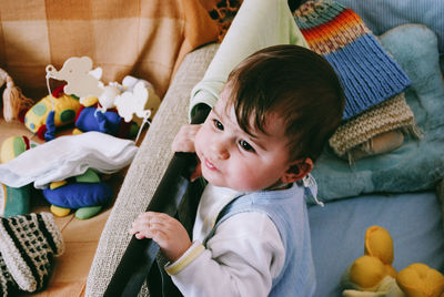 Cute boy on bed at home