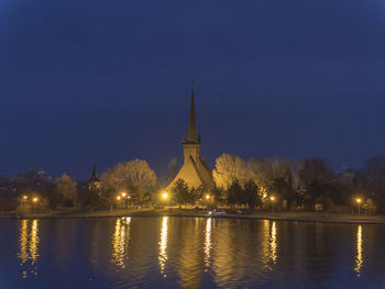 Illuminated buildings at waterfront