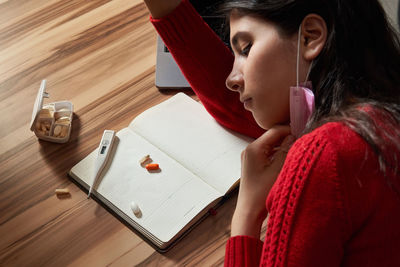 Sick woman lying on table