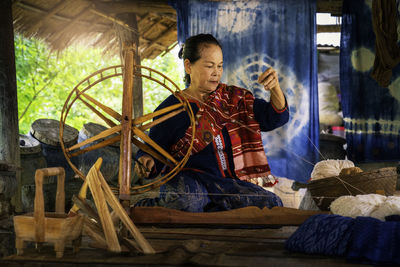Craftsmen of thai indigo. master are the original indigo cotton weaving in the community of thailand