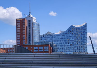 Elbphilharmonie concertn hall behind city stairs by day, hamburg, germany