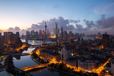 Illuminated buildings in city at night