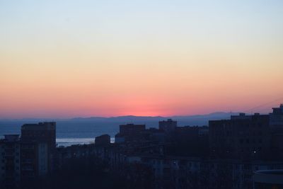 High angle view of buildings against sky during sunset