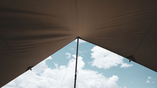 Low angle view of parasol against sky