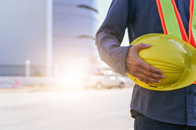 Midsection of man playing basketball