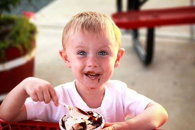 Portrait of cute boy eating ice cream