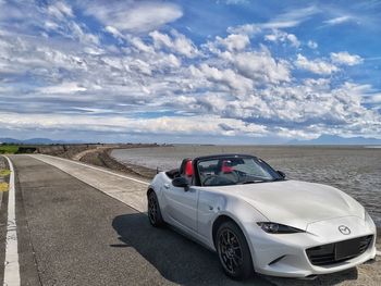 Cars on road against sky