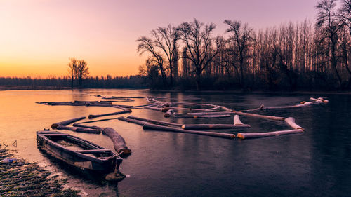 Scenic view of lake against sky during sunset