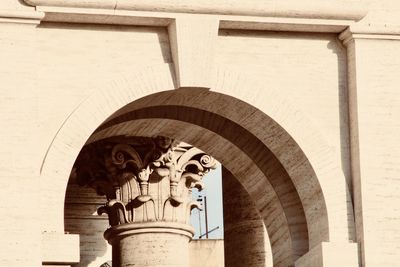 Low angle view of statue against historic building