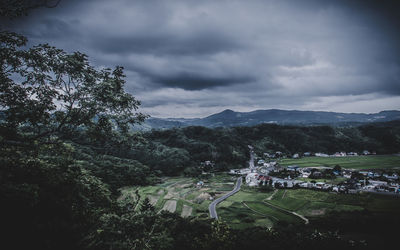 Scenic view of mountains against cloudy sky