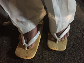 Close-up of shoes on ground