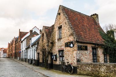 Old building in town against sky