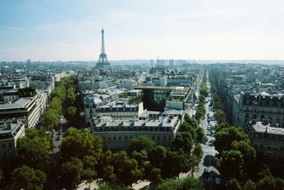 Mid distance view of eiffel tower amidst buildings in city