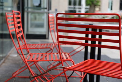 Red chairs in front of building