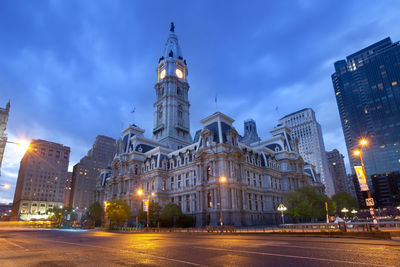 Low angle view of illuminated buildings at night