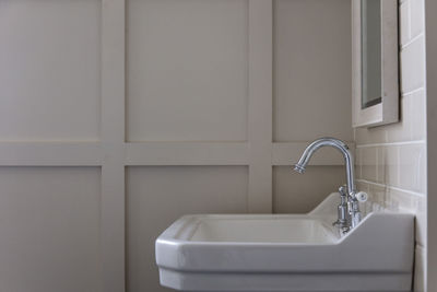 Close-up of faucet in bathroom at home