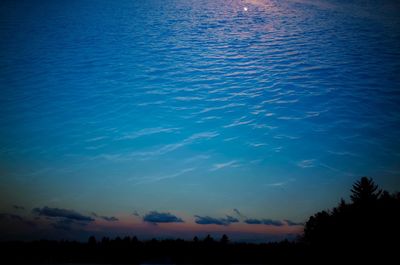 Silhouette of trees against sky at sunset