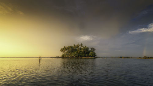 Scenic view of sea against sky at sunset