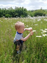 Boy and woman on field