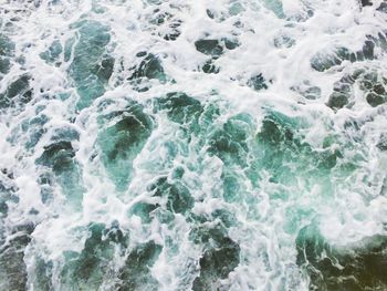 High angle view of waves splashing in sea