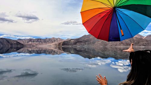 Rear view of woman standing on water