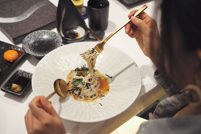 High angle view of woman preparing food