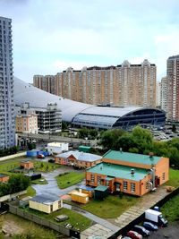 High angle view of buildings in city against sky