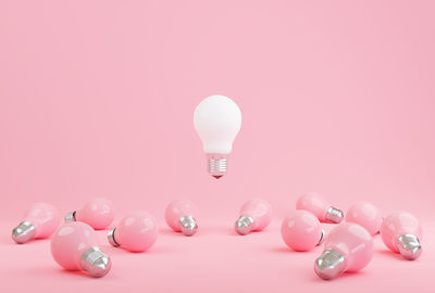 Close-up of light bulb on table