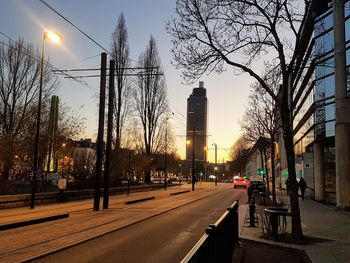 City street and buildings against sky