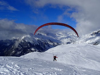 Tourists enjoying on snow covered mountain