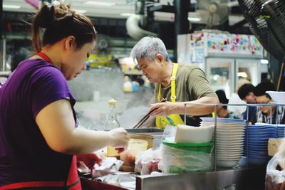 Person eating food in restaurant