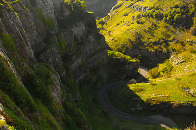 Aerial view of winding road amidst mountains