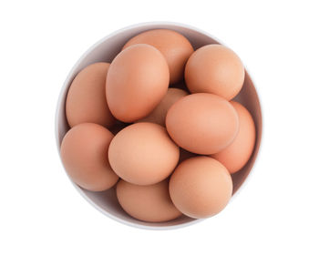 Close-up of eggs against white background