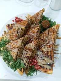 High angle view of fish in plate on table