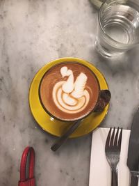 High angle view of coffee served on table