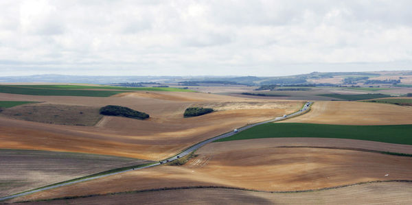 Aerial view of landscape against cloudy sky